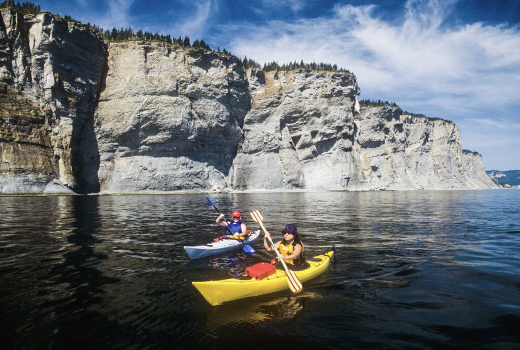 People kayaking the Gaspé Bay in Québec.