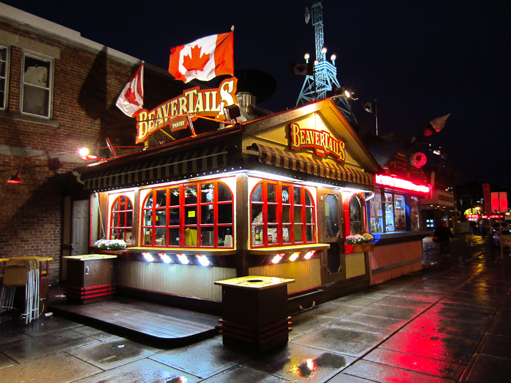 Image of BeaverTails restaurant lit up at night.