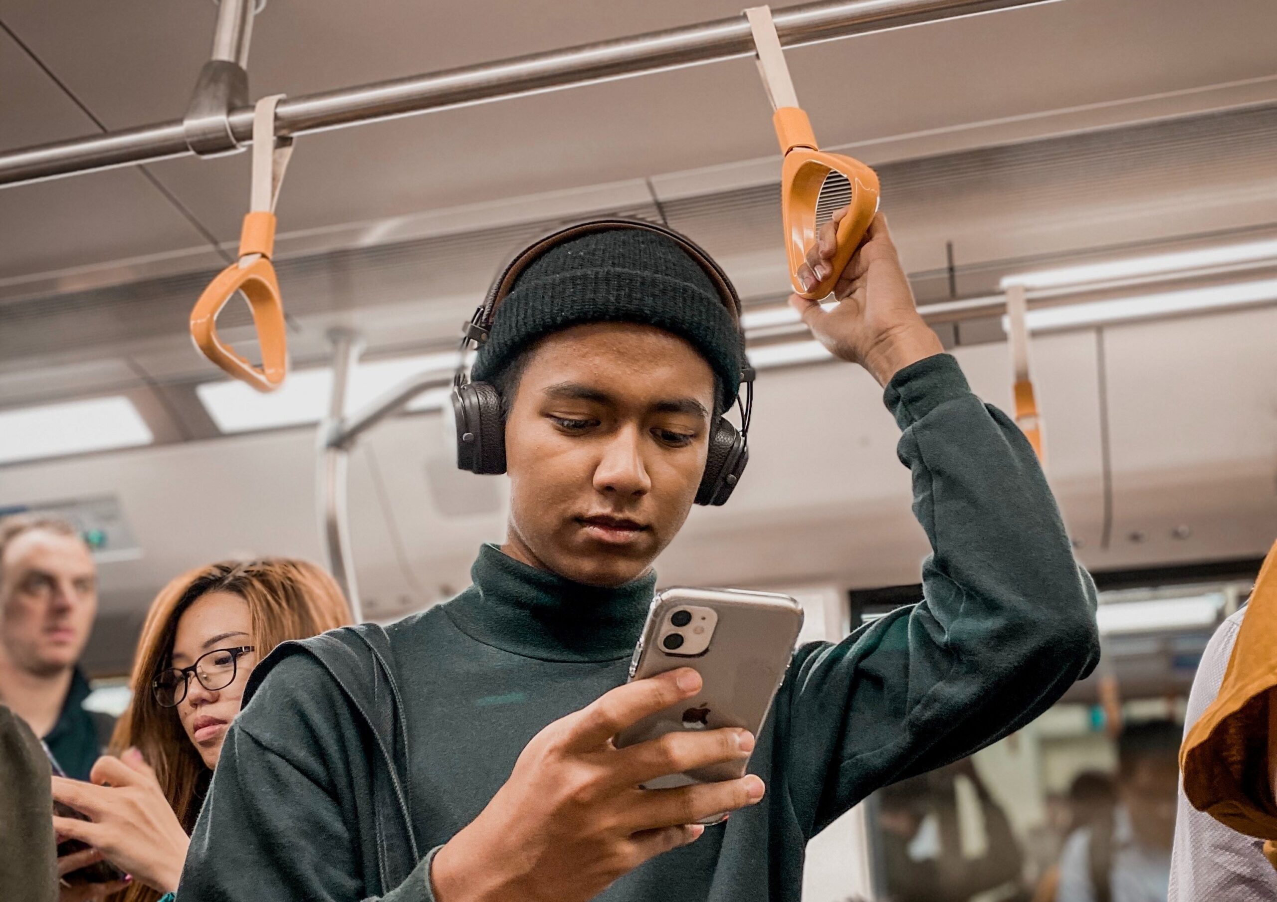 Photo of person using a SIM card in a phone on public transit in Canada.