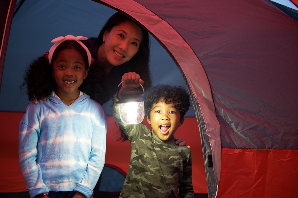 Family inside of camp at one of Ontario Parks.