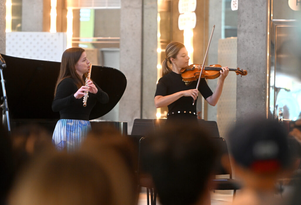 Member of the Toronto Symphony Orchestra playing an instrument.