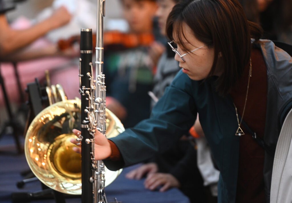 Member of the Toronto Symphony Orchestra playing an instrument.