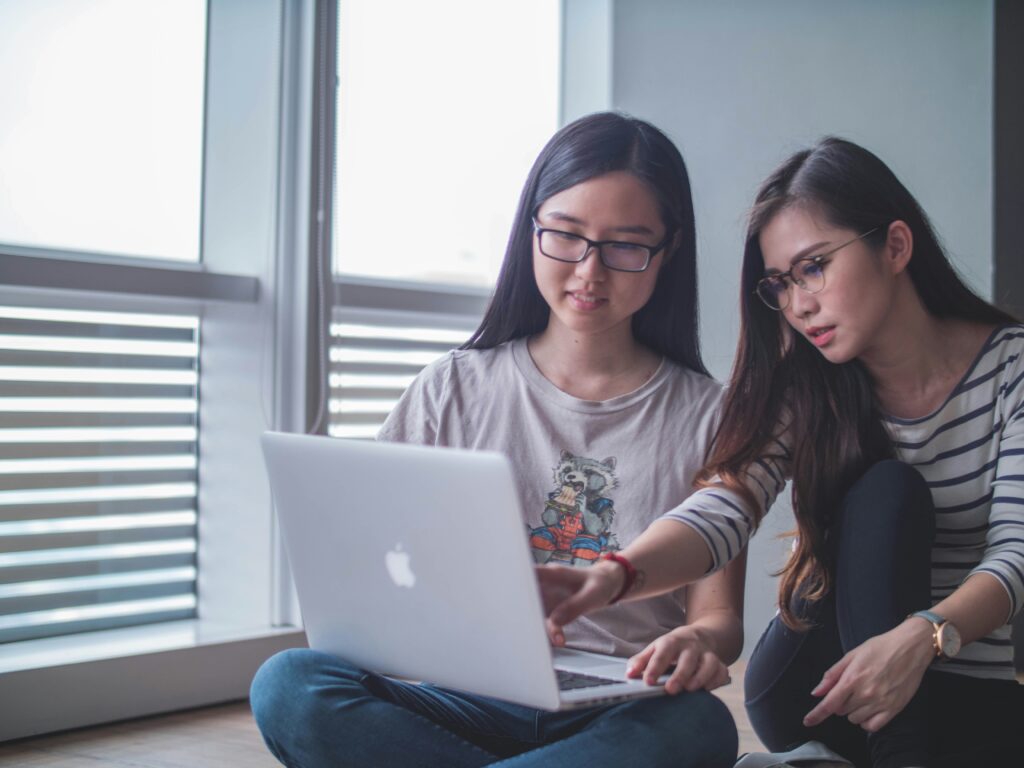 People working on a computer together to evaluate your credentials.